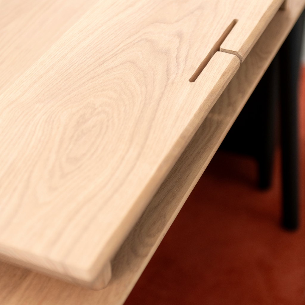 Close-up of a wooden desk with a edge detail