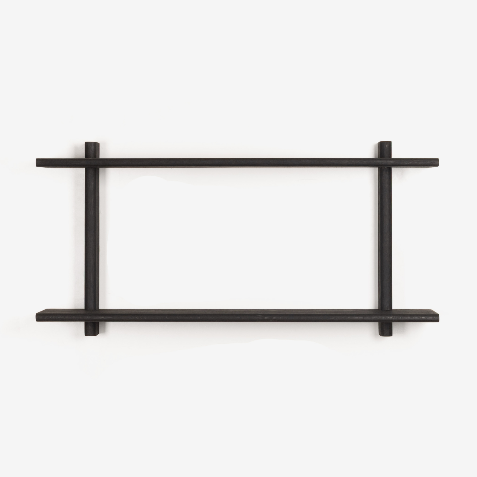 Black wall shelf with minimalist design on a white background