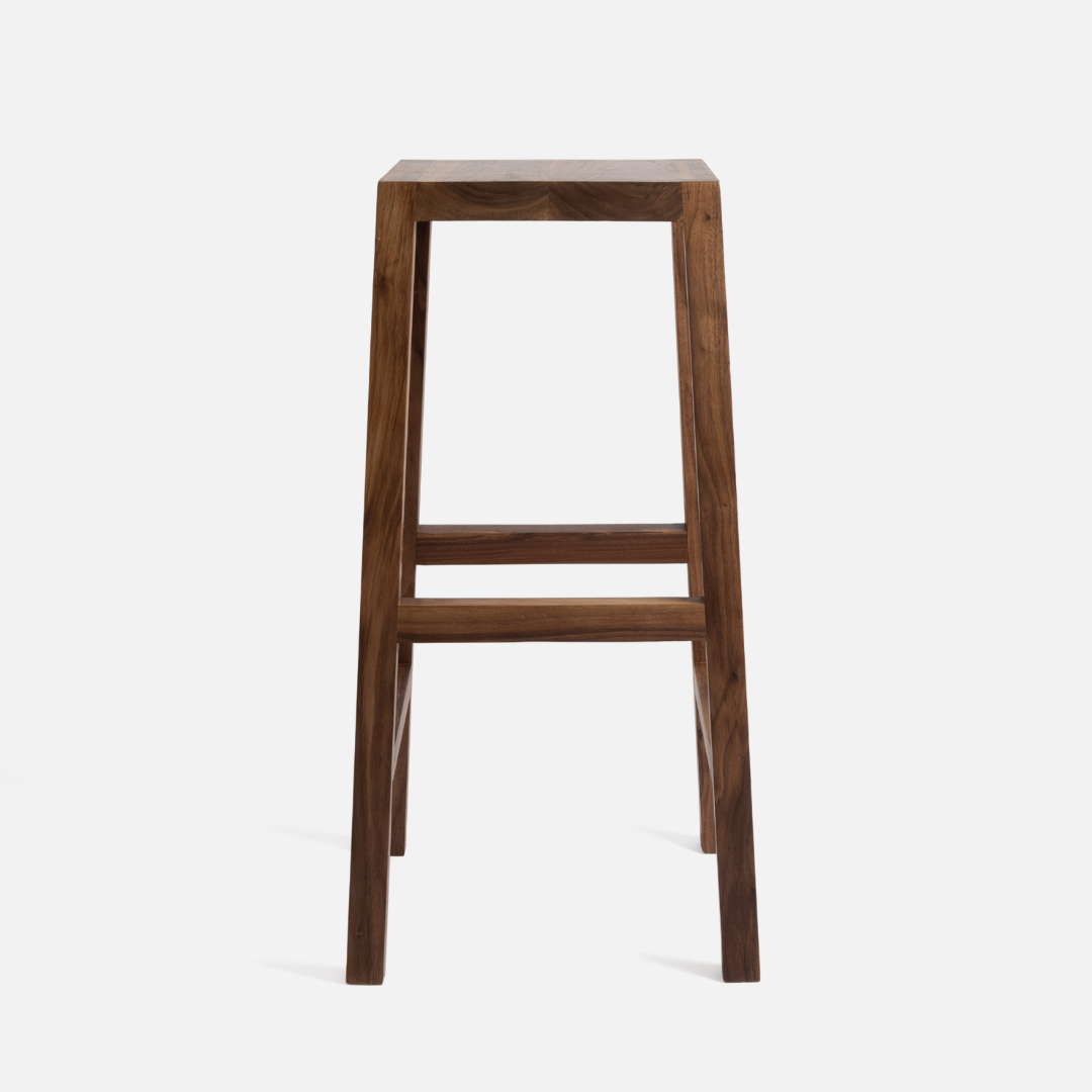 A walnut kitchen stool on a white background