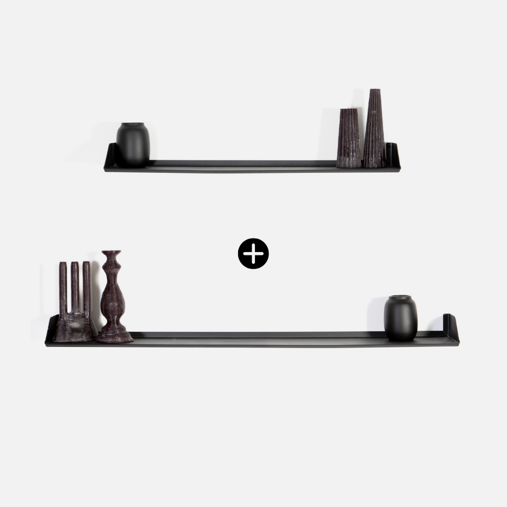 Two black shelves with decorative items on a white background