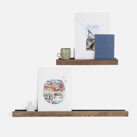 Wooden shelves with decorative items on a white background