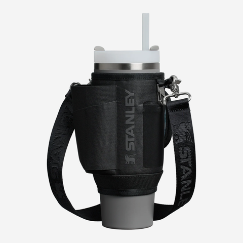 Black Stanley insulated cup holder with gray cup on a white background