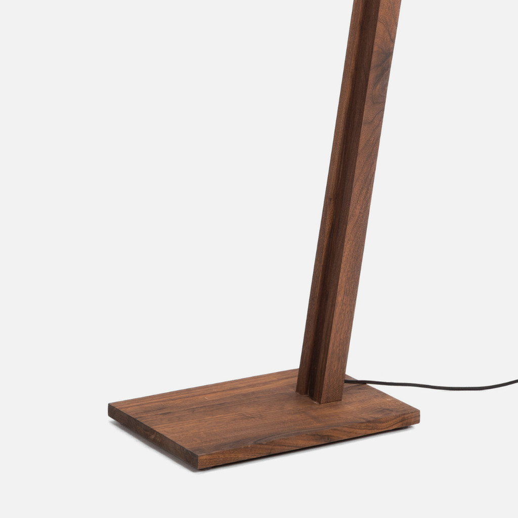 Wooden floor lamp with a square base on a white background