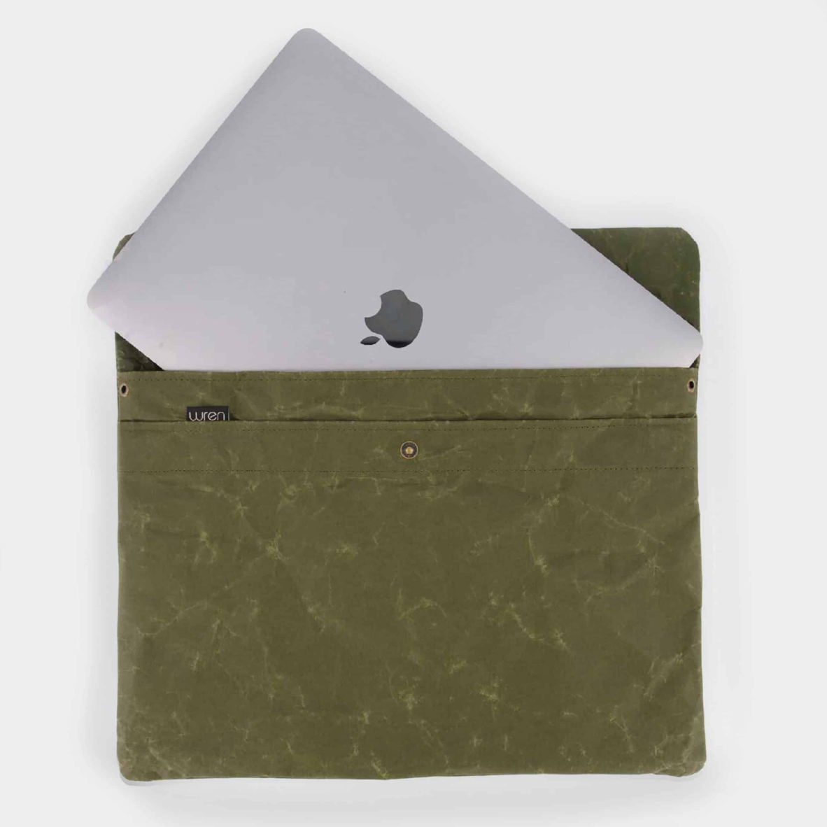 Green laptop sleeve with a silver laptop inside on a white background