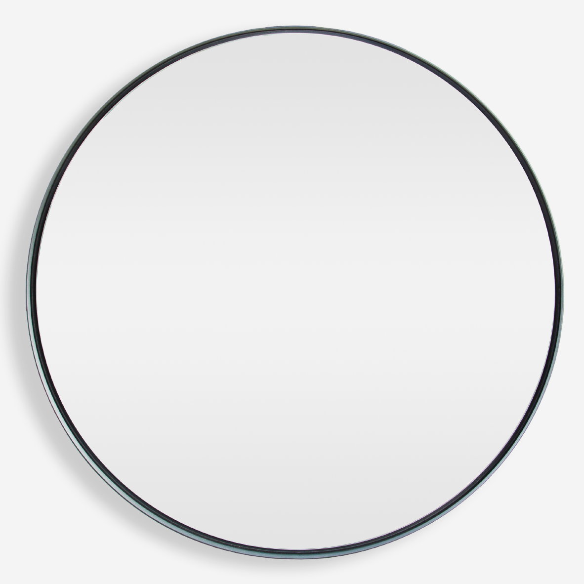 A large round mirror with a matte black powder-coated steel frame, sitting flush against the wall.